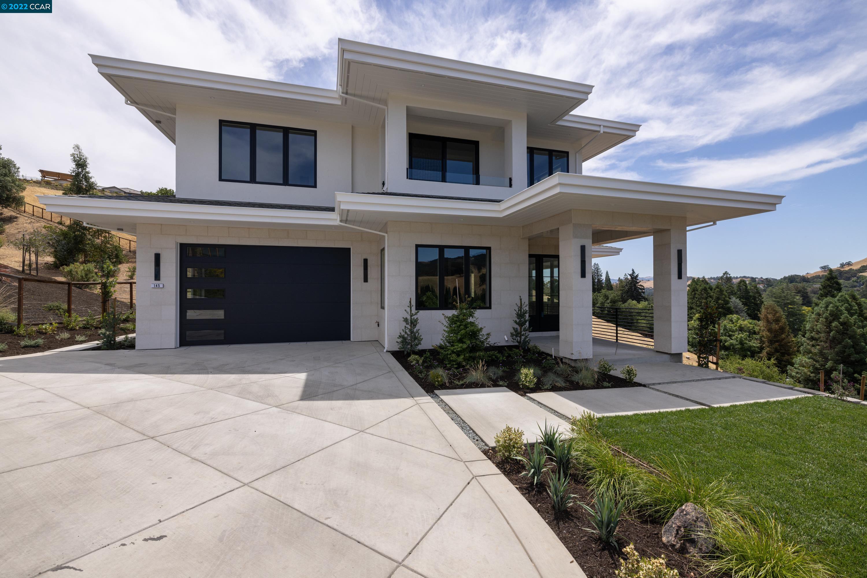 145 Arbor View Lane Lafayette, CA 94549 - Photo 3 of 46 a front view of a house with a yard and garage