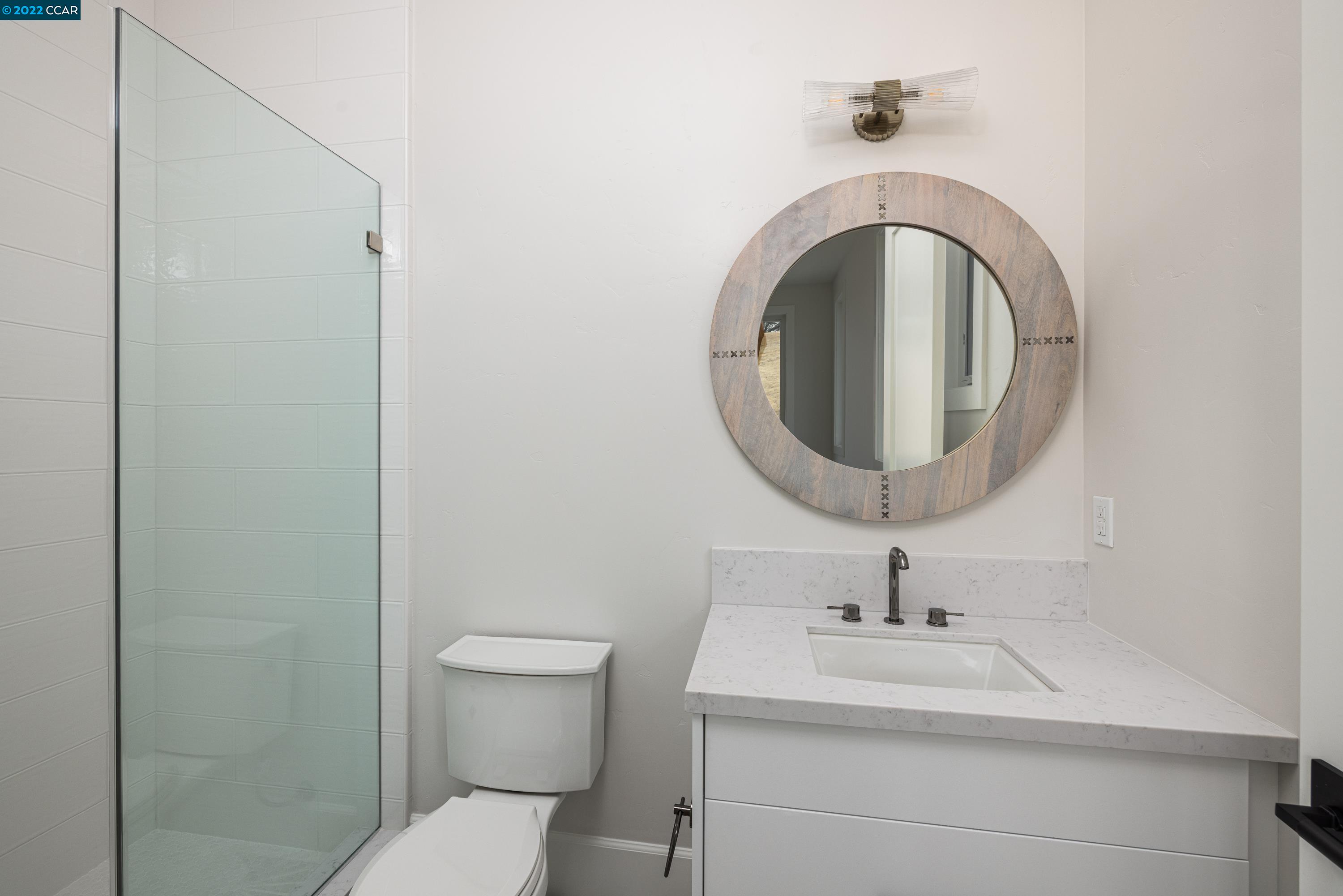 145 Arbor View Lane Lafayette, CA 94549 - Photo 34 of 46 a bathroom with a sink a toilet and a mirror