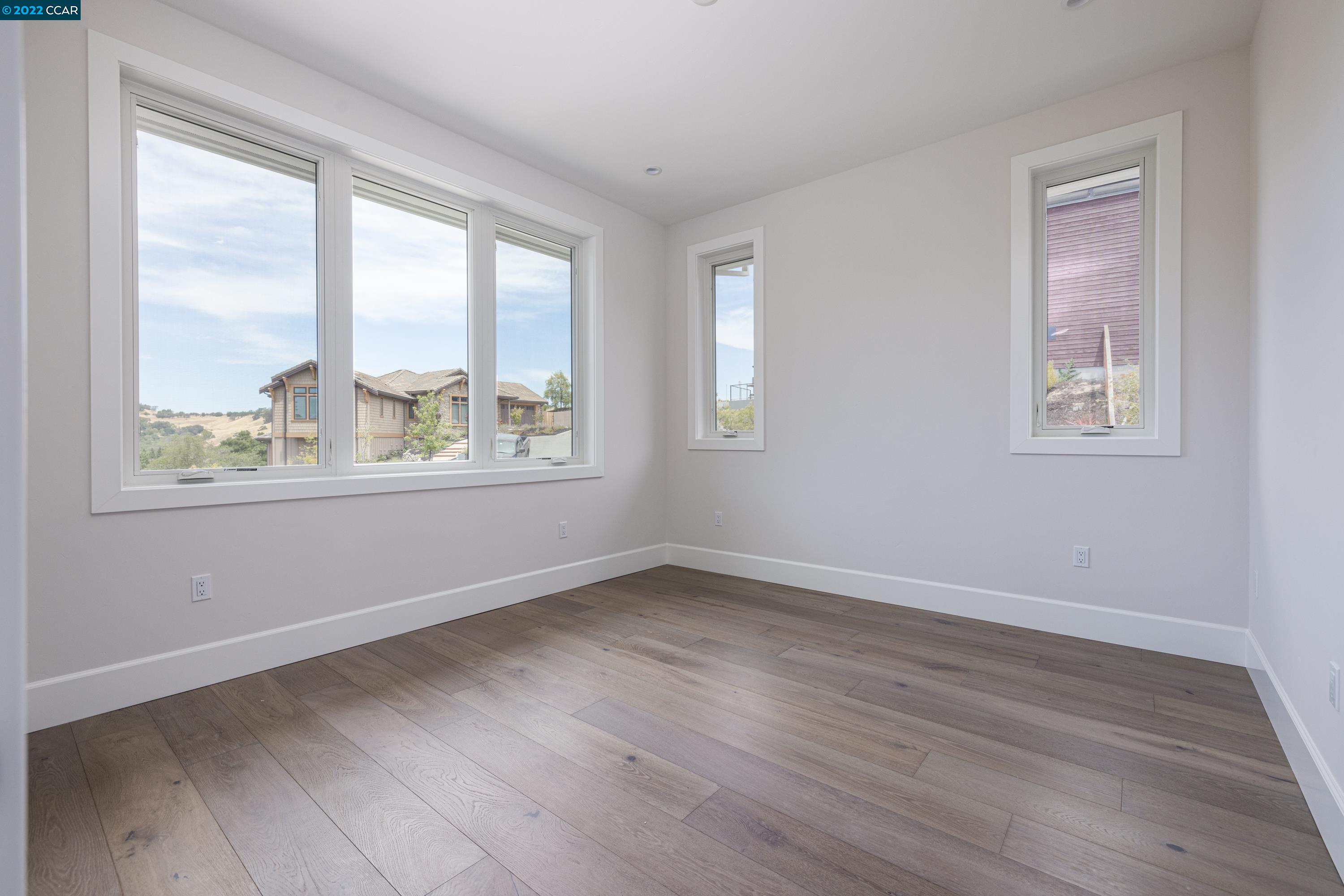 145 Arbor View Lane Lafayette, CA 94549 - Photo 36 of 46 a view of an empty room with wooden floor and a window
