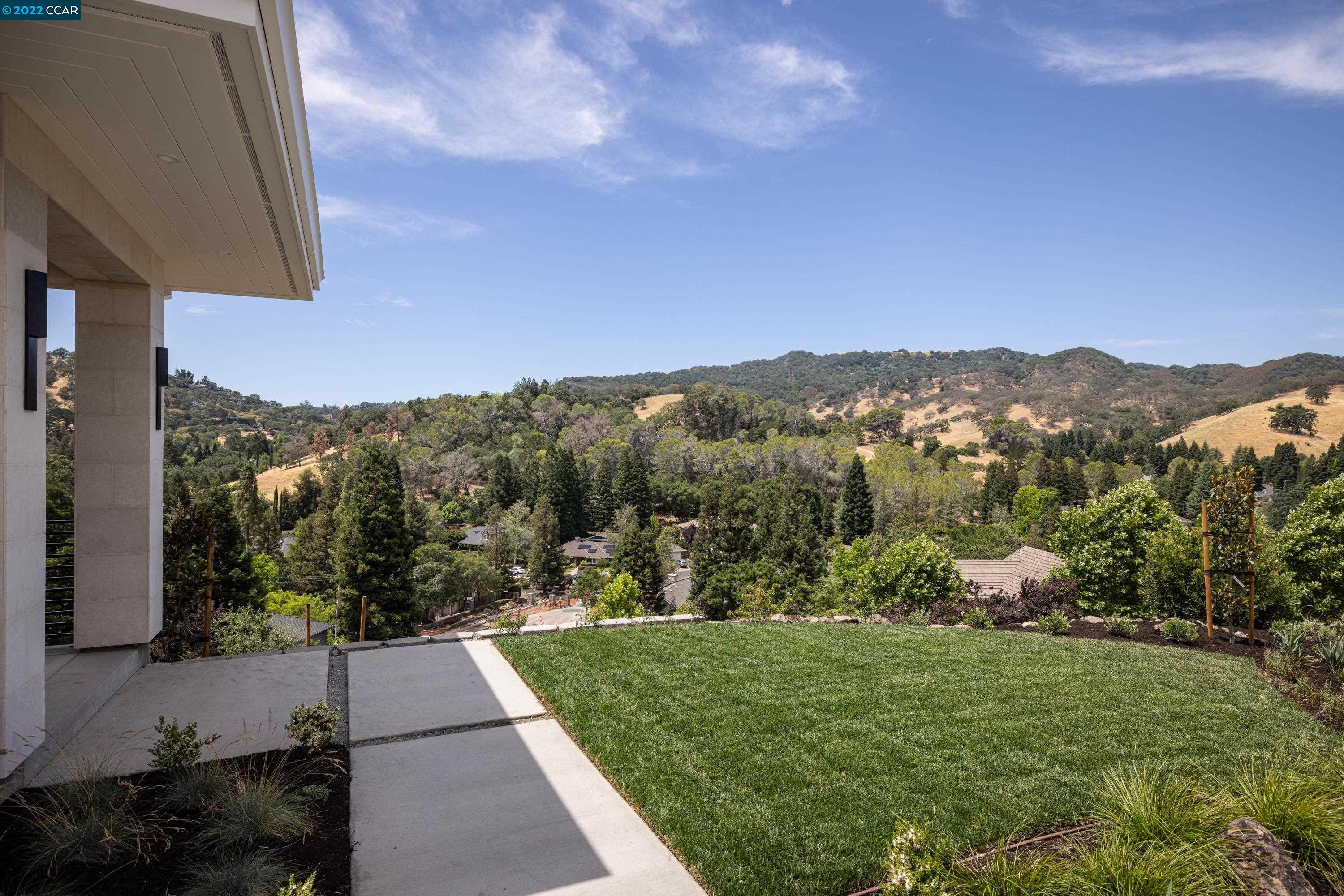 145 Arbor View Lane Lafayette, CA 94549 - Photo 4 of 46 a view of a city with lush green forest