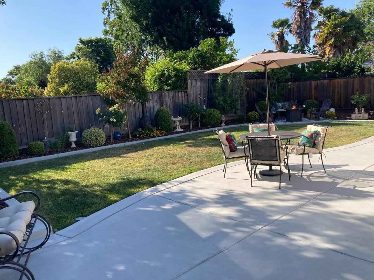 47 Avenida España San Jose, CA 95139 - Photo 2 of 3 a view of backyard with swimming pool and wooden fence
