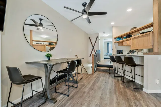 a work room with furniture and a wooden floor