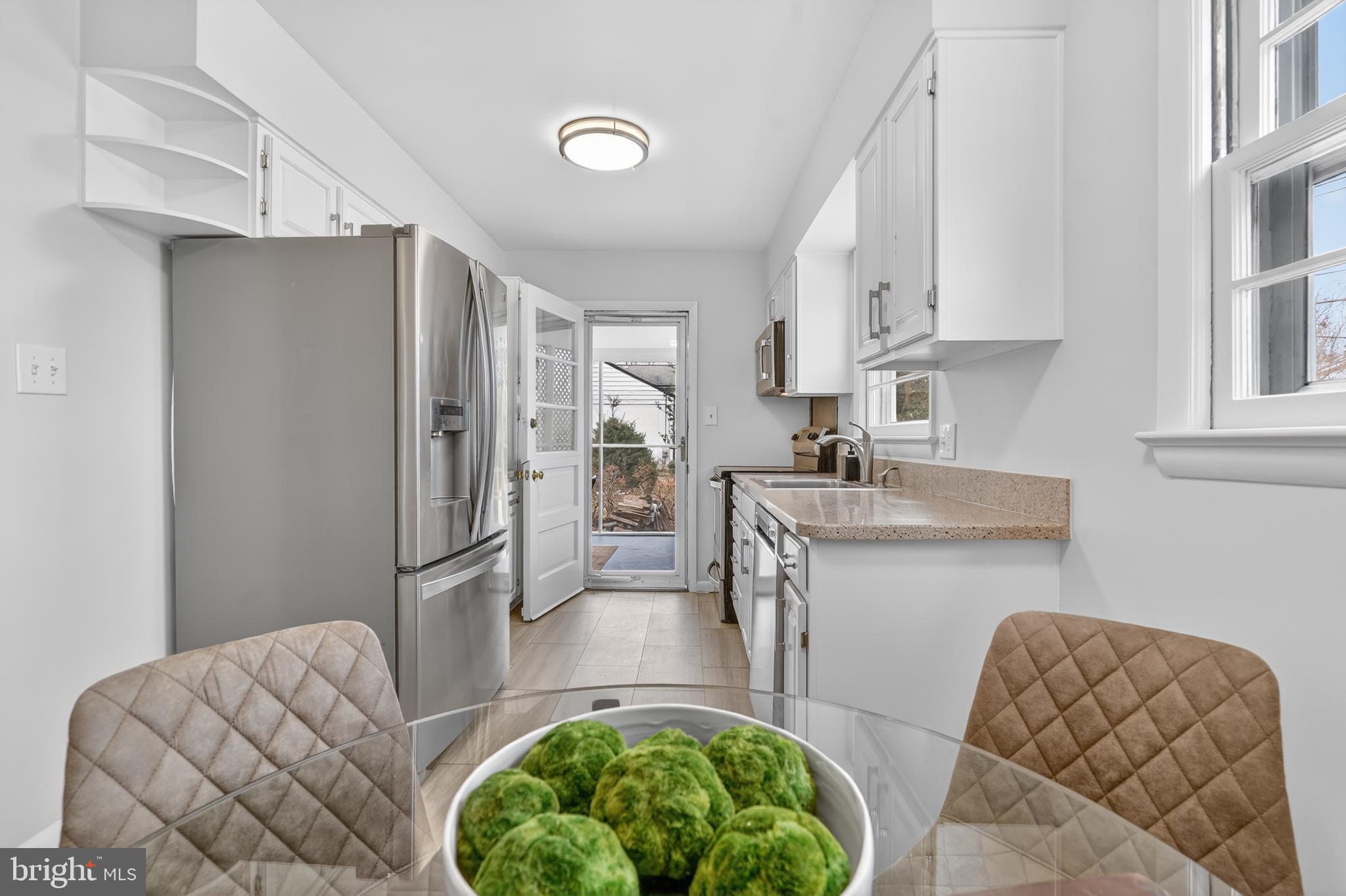 6312 Rockhurst Road Bethesda, MD 20817 - Photo 13 of 41 Kitchen opens to Screened Porch
