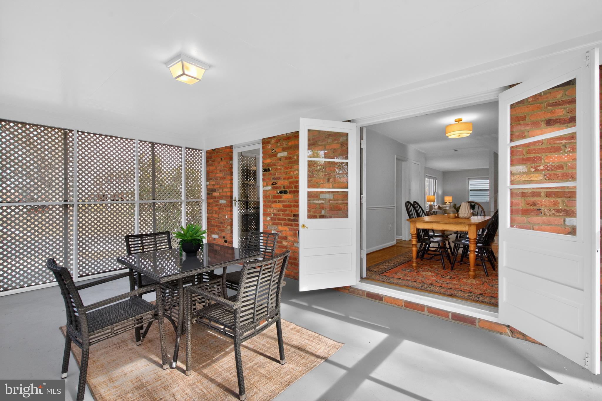 6312 Rockhurst Road Bethesda, MD 20817 - Photo 15 of 41 Screened Porch connects to dining room & kitchen