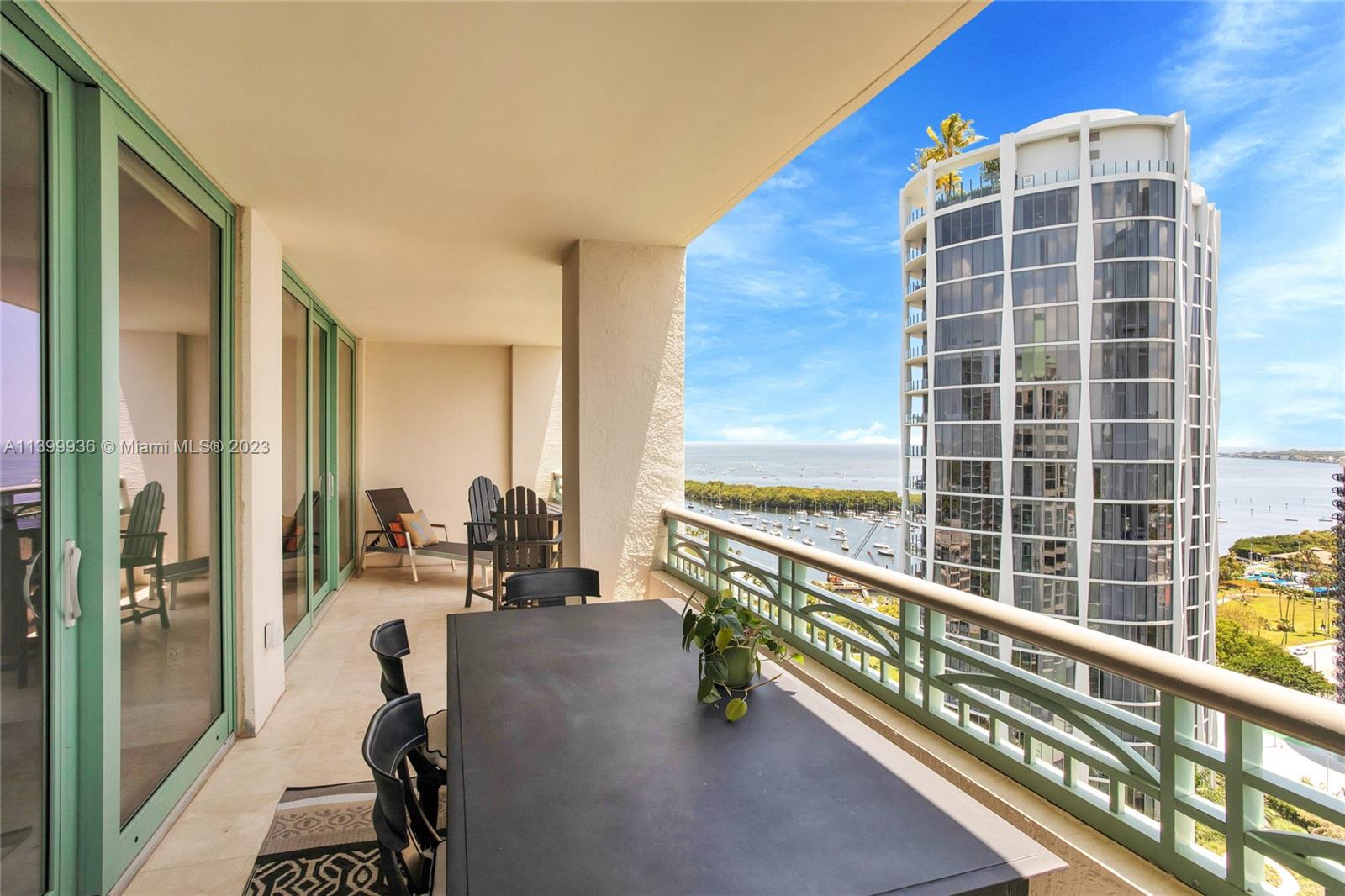 3400 Southwest 27th Avenue, Unit 1904 Coconut Grove, FL 33133 - Photo 1 of 20 a view of living room with balcony and furniture