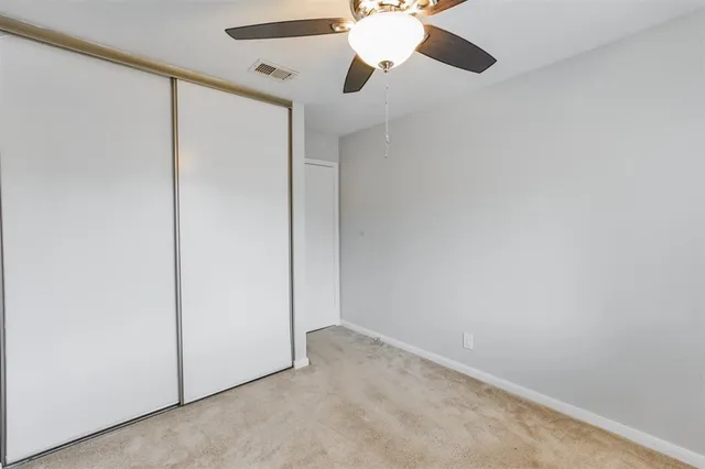 an empty room with fan