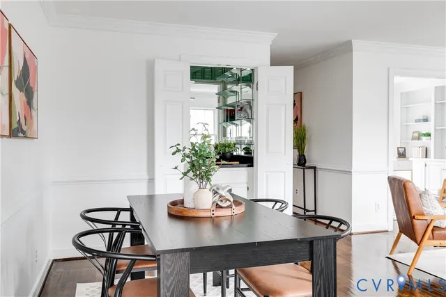a view of a dining room with furniture window and wooden floor