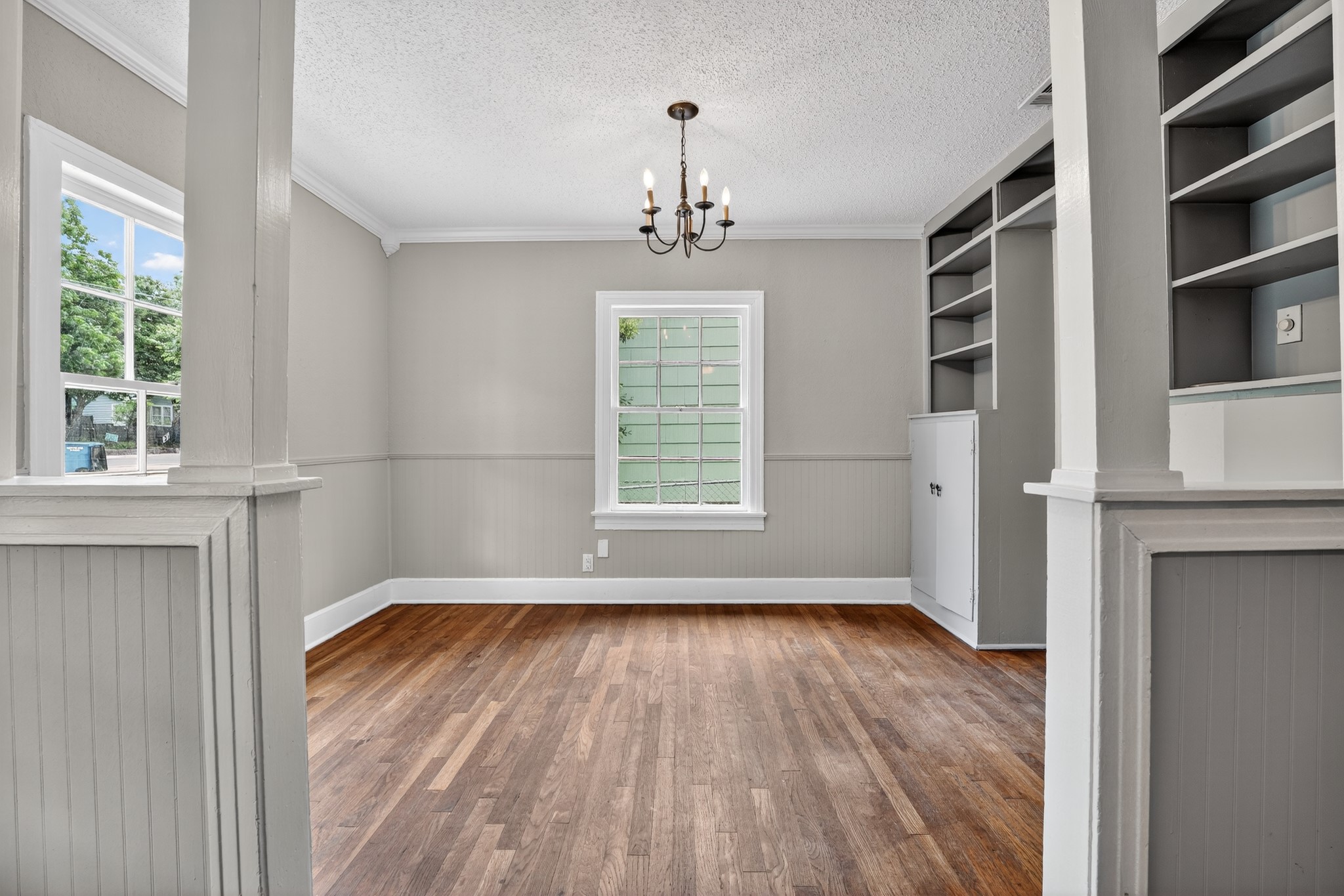 4907 Duval Street Austin, TX 78751 - Photo 8 of 31 a view of empty room with wooden floor and fan