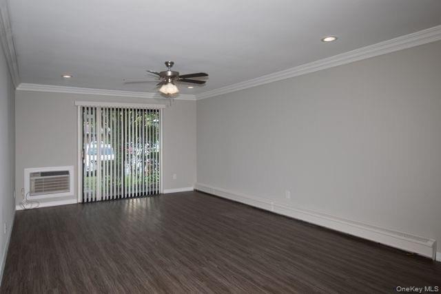 1593 August Road, Unit 1767 North Babylon, NY 11703 - Photo 6 of 10 wooden floor in an empty room with a window
