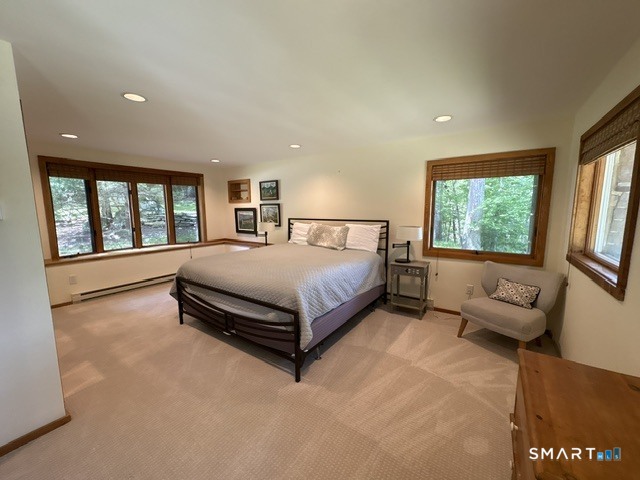 40 Looking Glass Hill Road Litchfield, CT 06750 - Photo 29 of 33 a spacious bedroom with a bed and large windows
