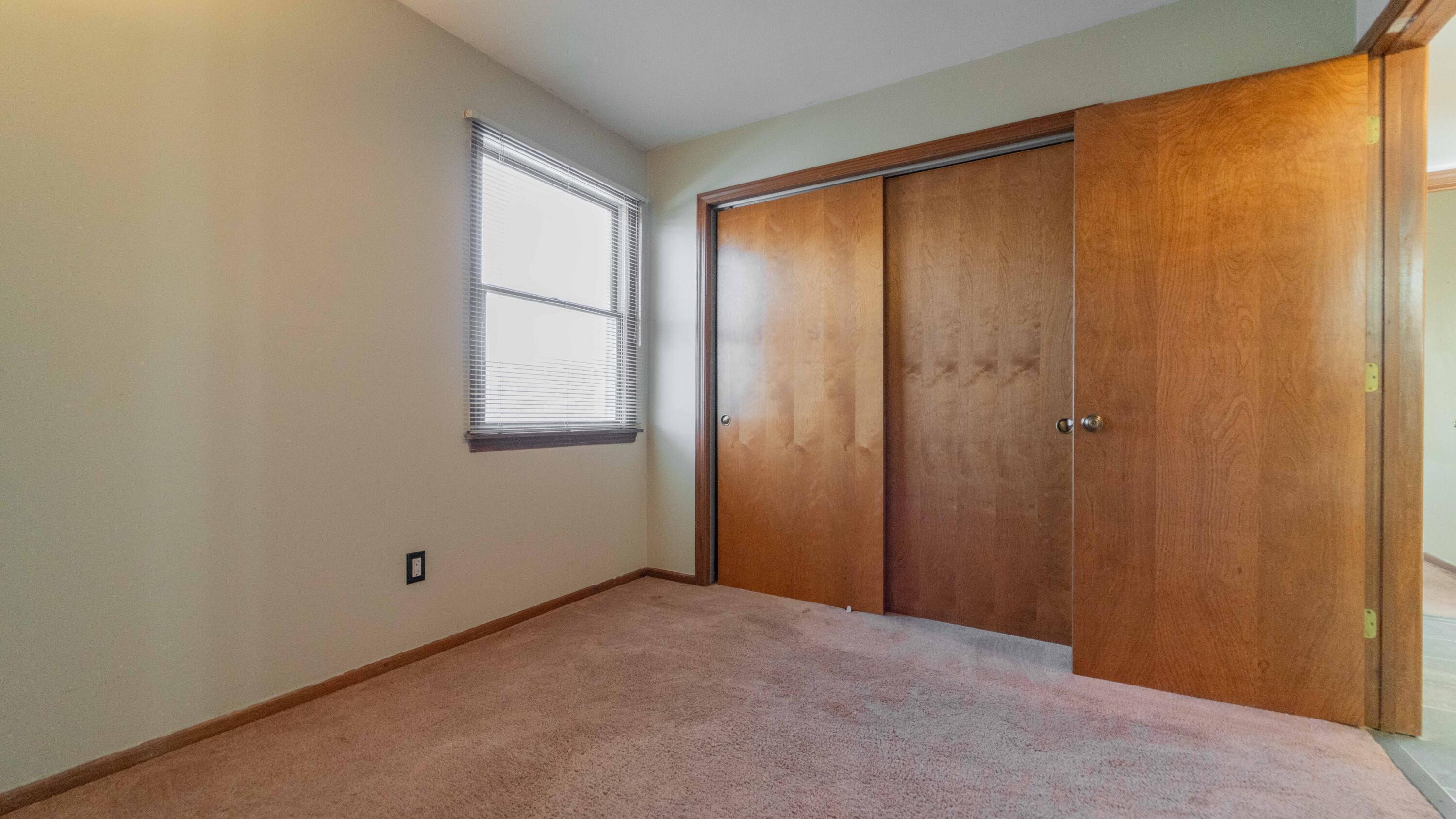 1069 Millpond Road, Unit E Valparaiso, IN 46385 - Photo 10 of 19 a view of an empty room with a window