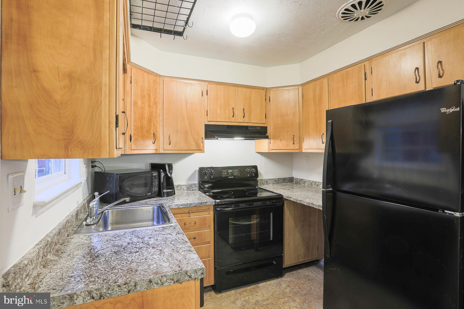 1010 Kingston Road Baltimore, MD 21208 - Photo 6 of 43 Kitchen with wood cabinets