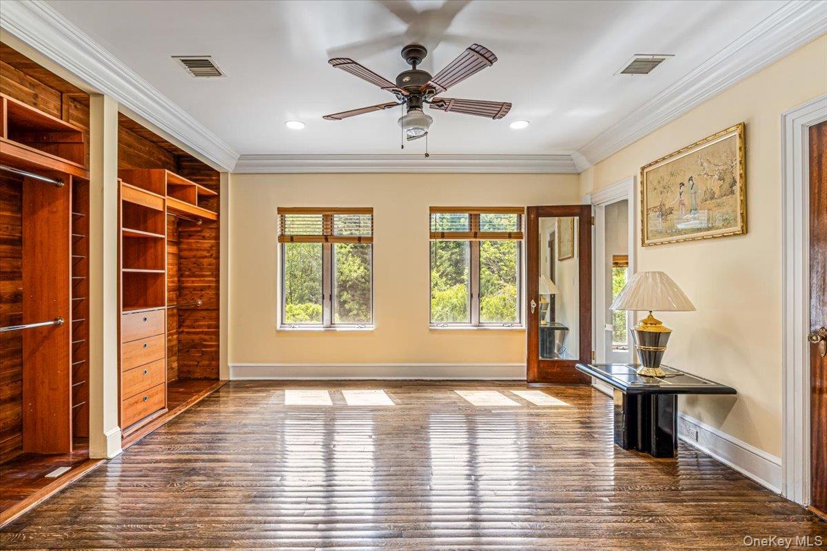 952 Cedar Swamp Road Glen Head, NY 11545 - Photo 31 of 50 an empty room with wooden floor and windows