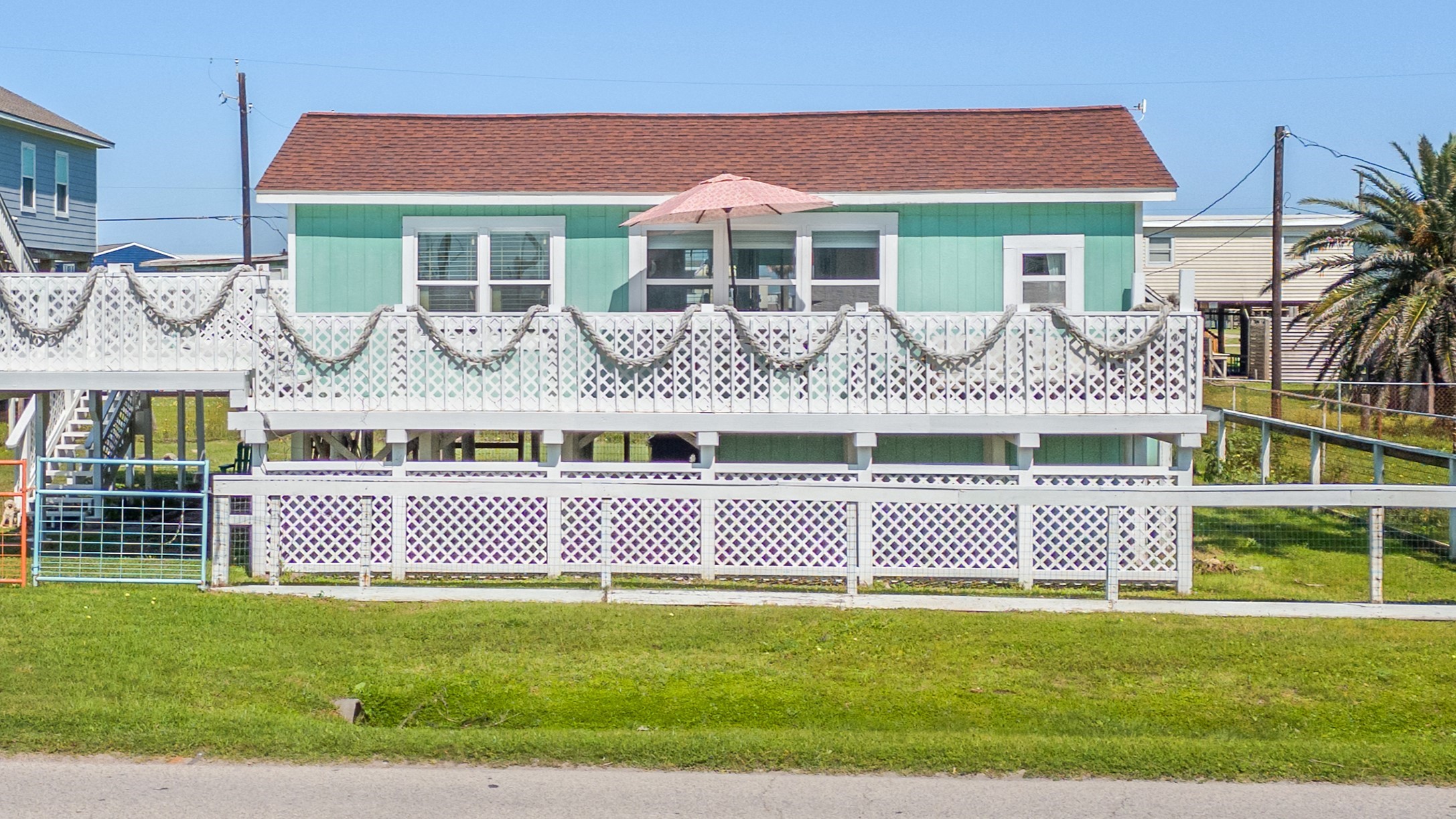 1010 Fort Velasco Drive Surfside Beach, TX 77541 - Photo 1 of 21 a front view of a house with a garden