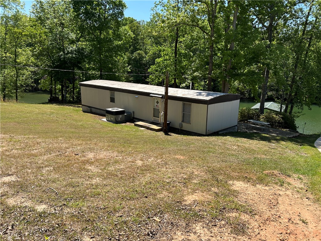 43 Sunset Cove Road Abbeville, SC 29620 - Photo 41 of 41 This tranquil waterfront property offers a peaceful escape amidst lush greenery and serene views.