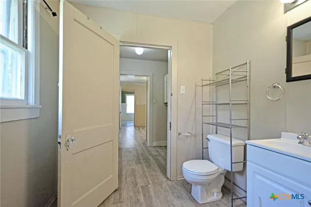 a bathroom with a toilet and a sink