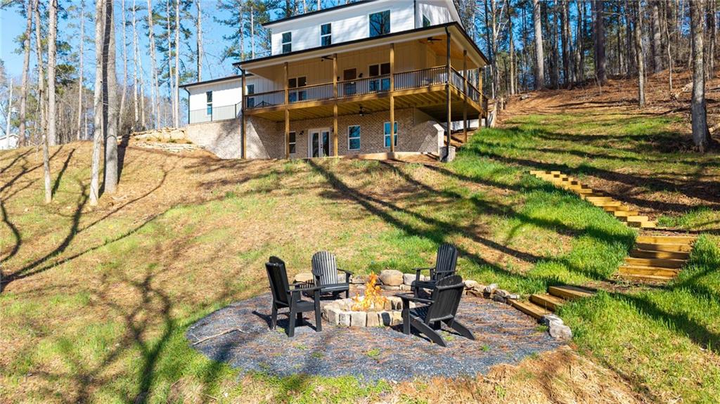 1783 4 Mile Church Road Ball Ground, GA 30107 - Photo 11 of 60 a view of a building with backyard