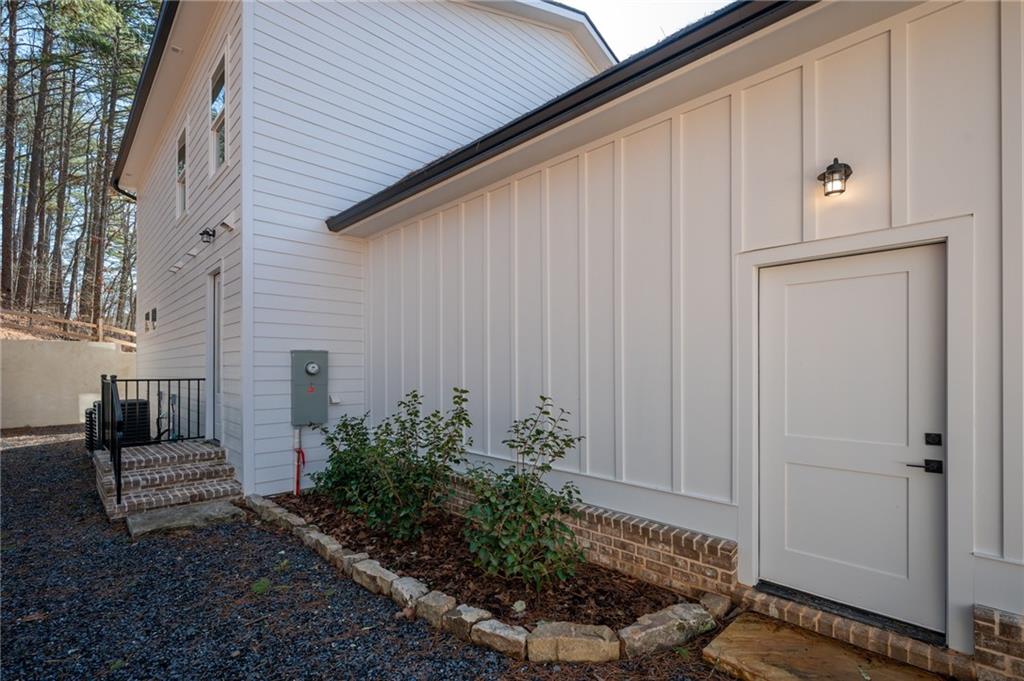 1783 4 Mile Church Road Ball Ground, GA 30107 - Photo 13 of 60 a view of a entryway door of the house