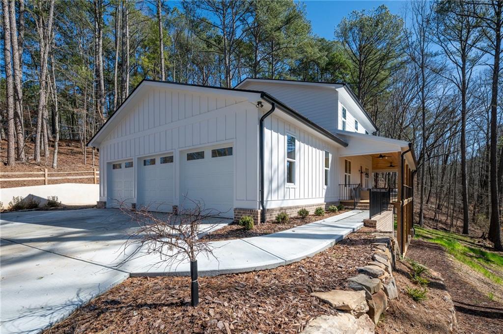 1783 4 Mile Church Road Ball Ground, GA 30107 - Photo 14 of 60 a house with trees in the background