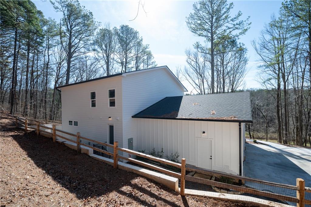 1783 4 Mile Church Road Ball Ground, GA 30107 - Photo 15 of 60 a view of a back yard of the house