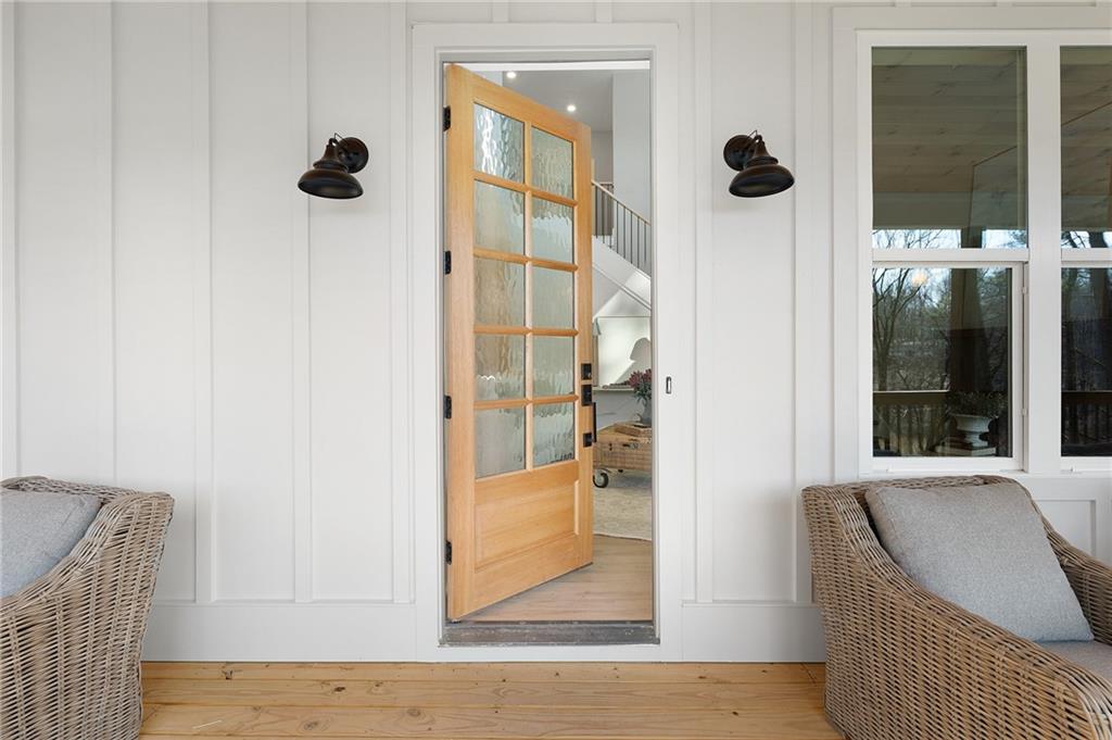 1783 4 Mile Church Road Ball Ground, GA 30107 - Photo 16 of 60 wooden floor with a rug and a window in a room