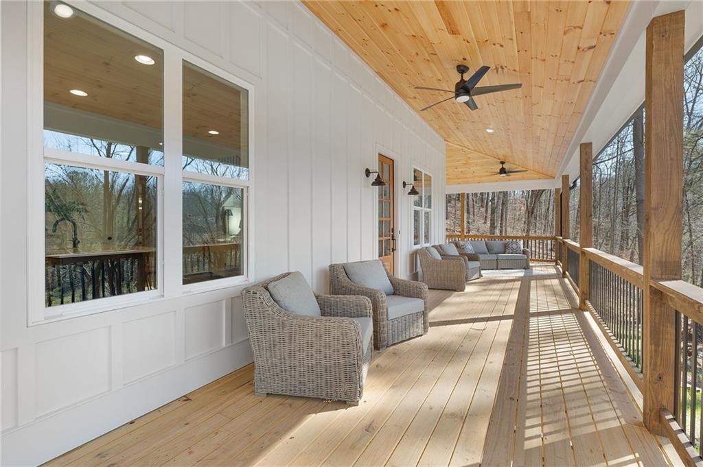 1783 4 Mile Church Road Ball Ground, GA 30107 - Photo 17 of 60 a living room with furniture and a large window