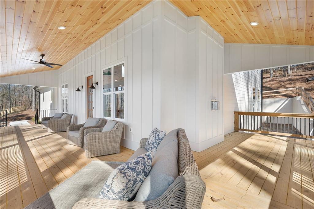 1783 4 Mile Church Road Ball Ground, GA 30107 - Photo 18 of 60 a bedroom with furniture and a large window