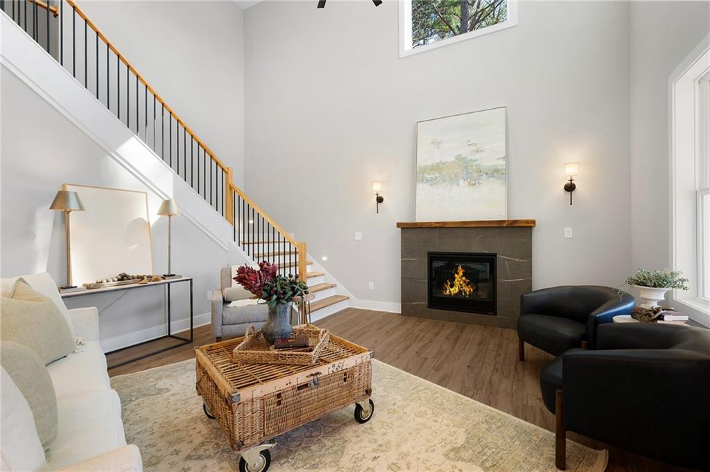 1783 4 Mile Church Road Ball Ground, GA 30107 - Photo 21 of 60 a living room with furniture and a fireplace