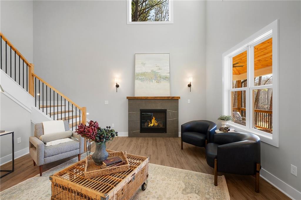 1783 4 Mile Church Road Ball Ground, GA 30107 - Photo 23 of 60 a living room with furniture and a fireplace