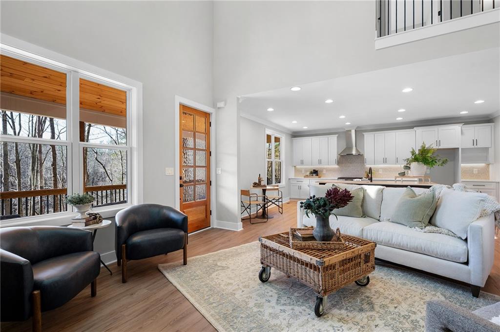 1783 4 Mile Church Road Ball Ground, GA 30107 - Photo 24 of 60 a living room with furniture and a large window