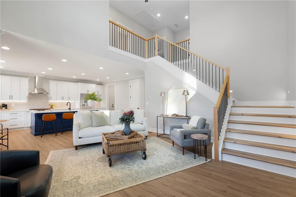 1783 4 Mile Church Road Ball Ground, GA 30107 - Photo 25 of 60 a living room with furniture and a wooden floor