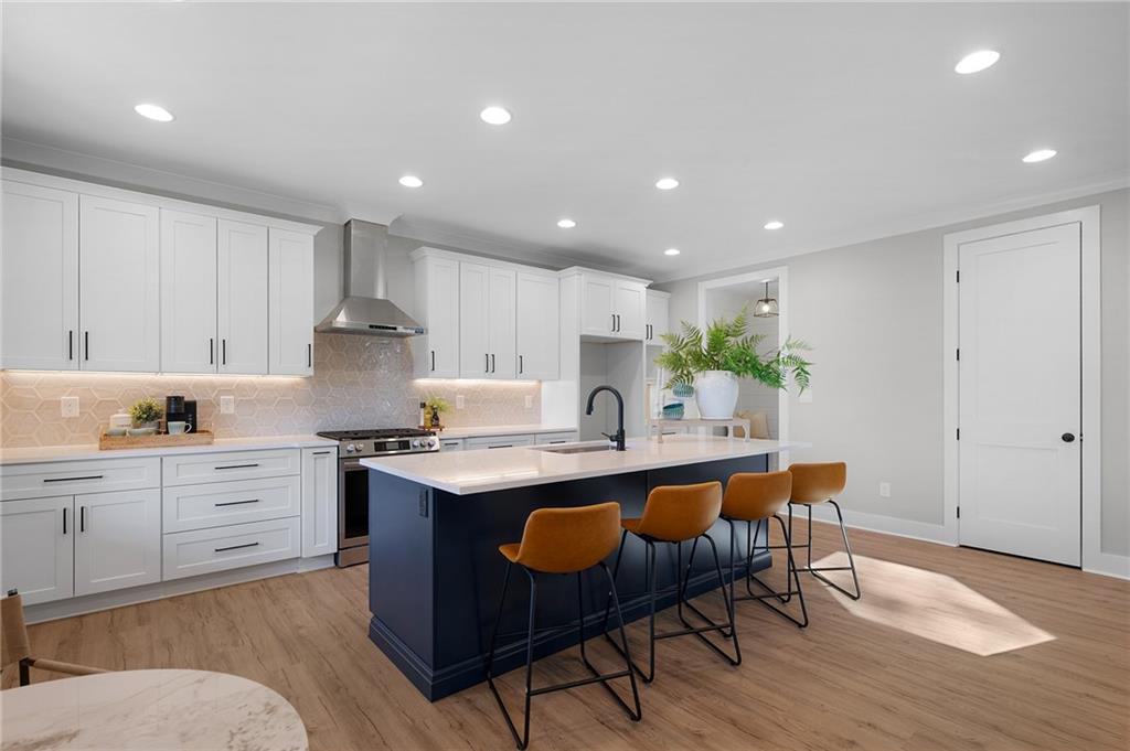 1783 4 Mile Church Road Ball Ground, GA 30107 - Photo 26 of 60 a kitchen with stainless steel appliances granite countertop a table chairs sink and cabinets