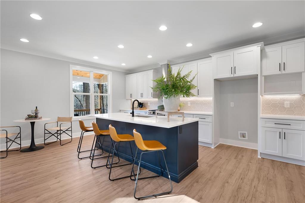 1783 4 Mile Church Road Ball Ground, GA 30107 - Photo 29 of 60 a kitchen with a table and chairs in it