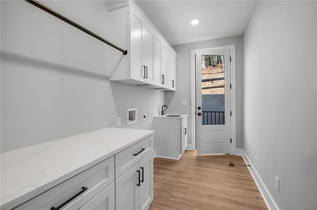 1783 4 Mile Church Road Ball Ground, GA 30107 - Photo 35 of 60 a view of a kitchen with electric appliances