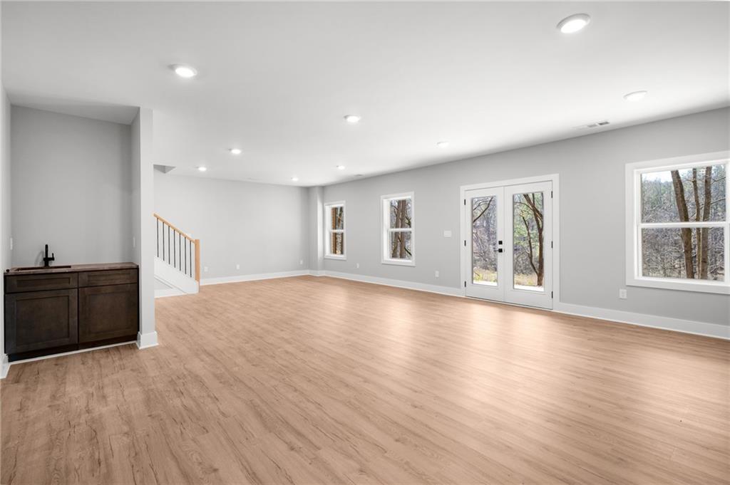 1783 4 Mile Church Road Ball Ground, GA 30107 - Photo 56 of 60 a view of an empty room with wooden floor and a window