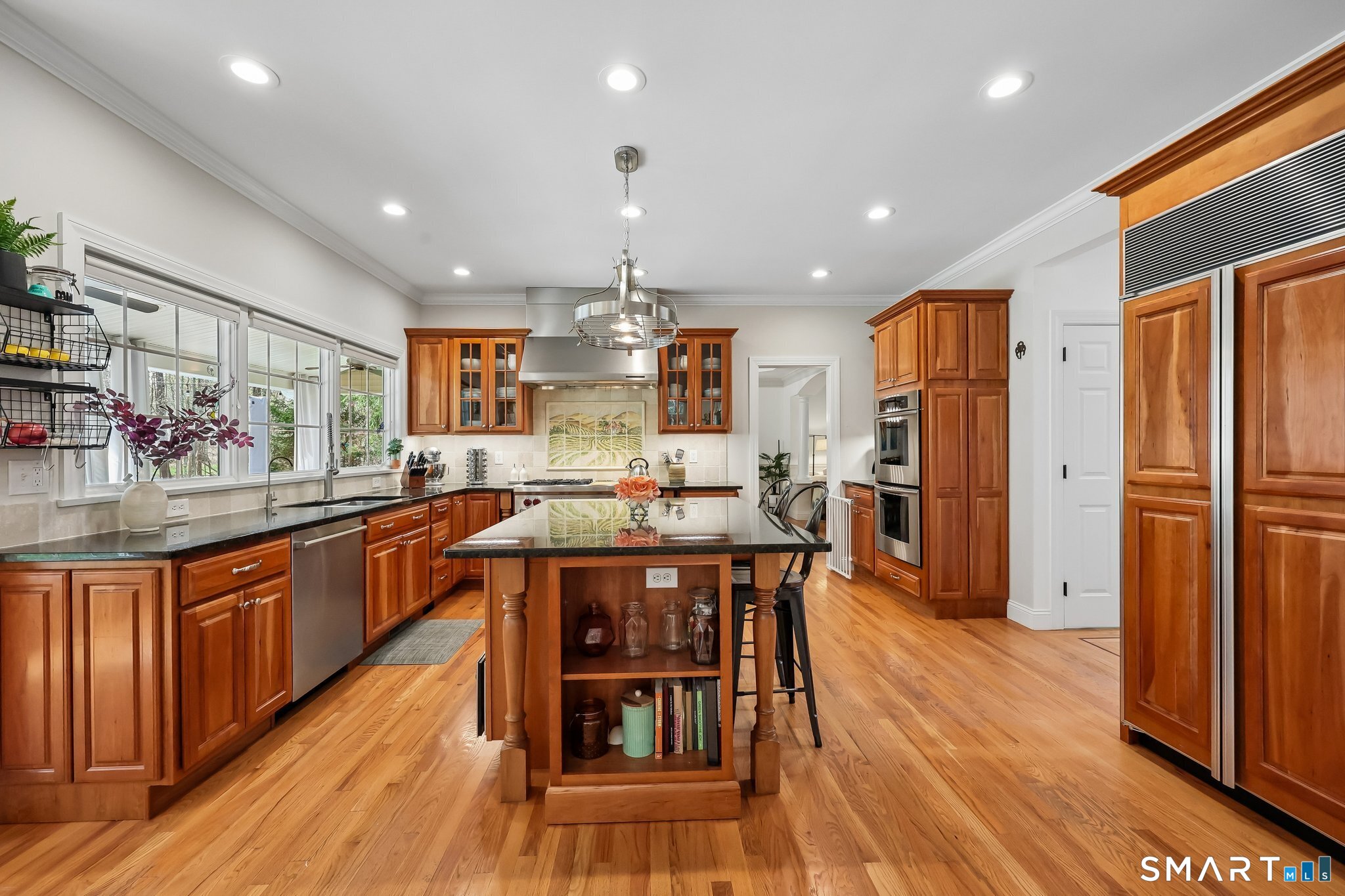 3 East Lake Road Danbury, CT 06811 - Photo 15 of 37 The kitchen offers abundant cabinet space complemented by a pantry and generous island storage, ensuring both functionality and effortless organization.