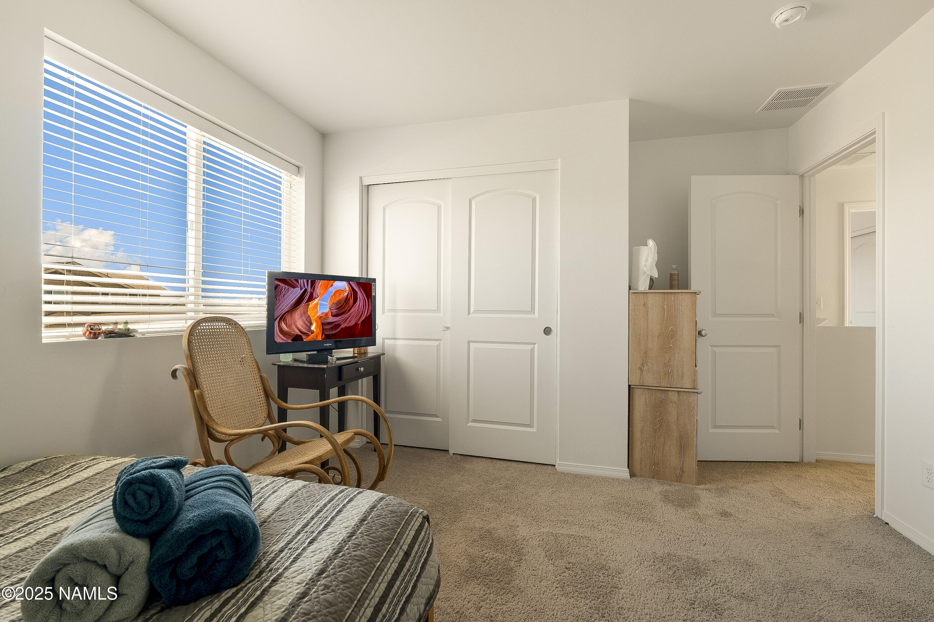12361 Pegasus Road Bellemont, AZ 86015 - Photo 11 of 18 a view of a workspace with furniture and a window