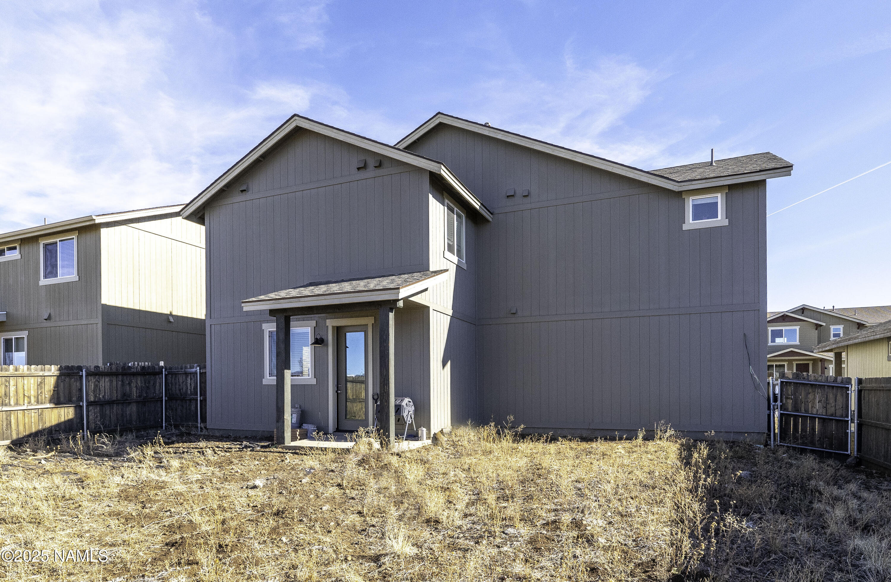 12361 Pegasus Road Bellemont, AZ 86015 - Photo 16 of 18 a house with a large tree in front of it