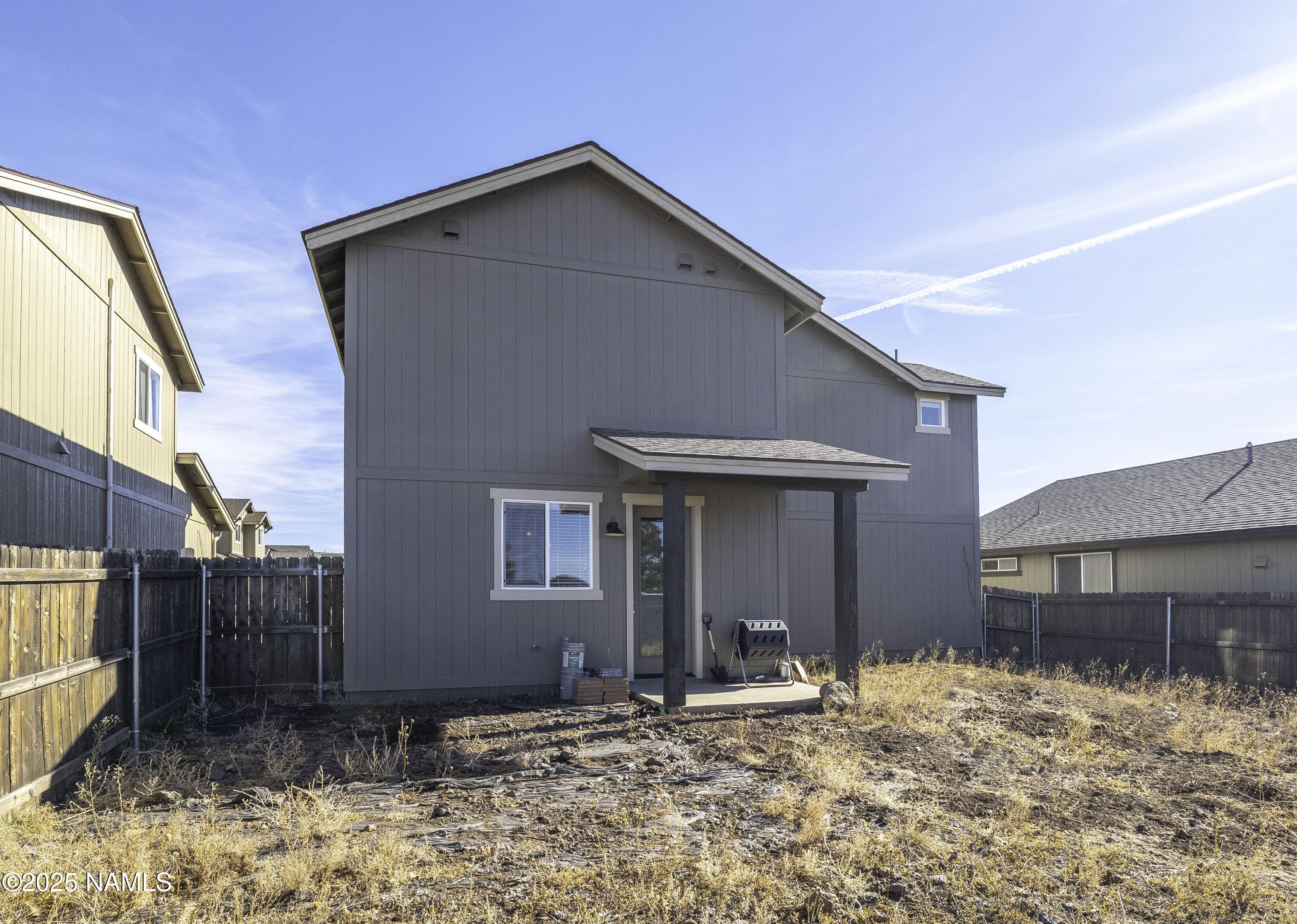 12361 Pegasus Road Bellemont, AZ 86015 - Photo 17 of 18 a front view of a house with a yard