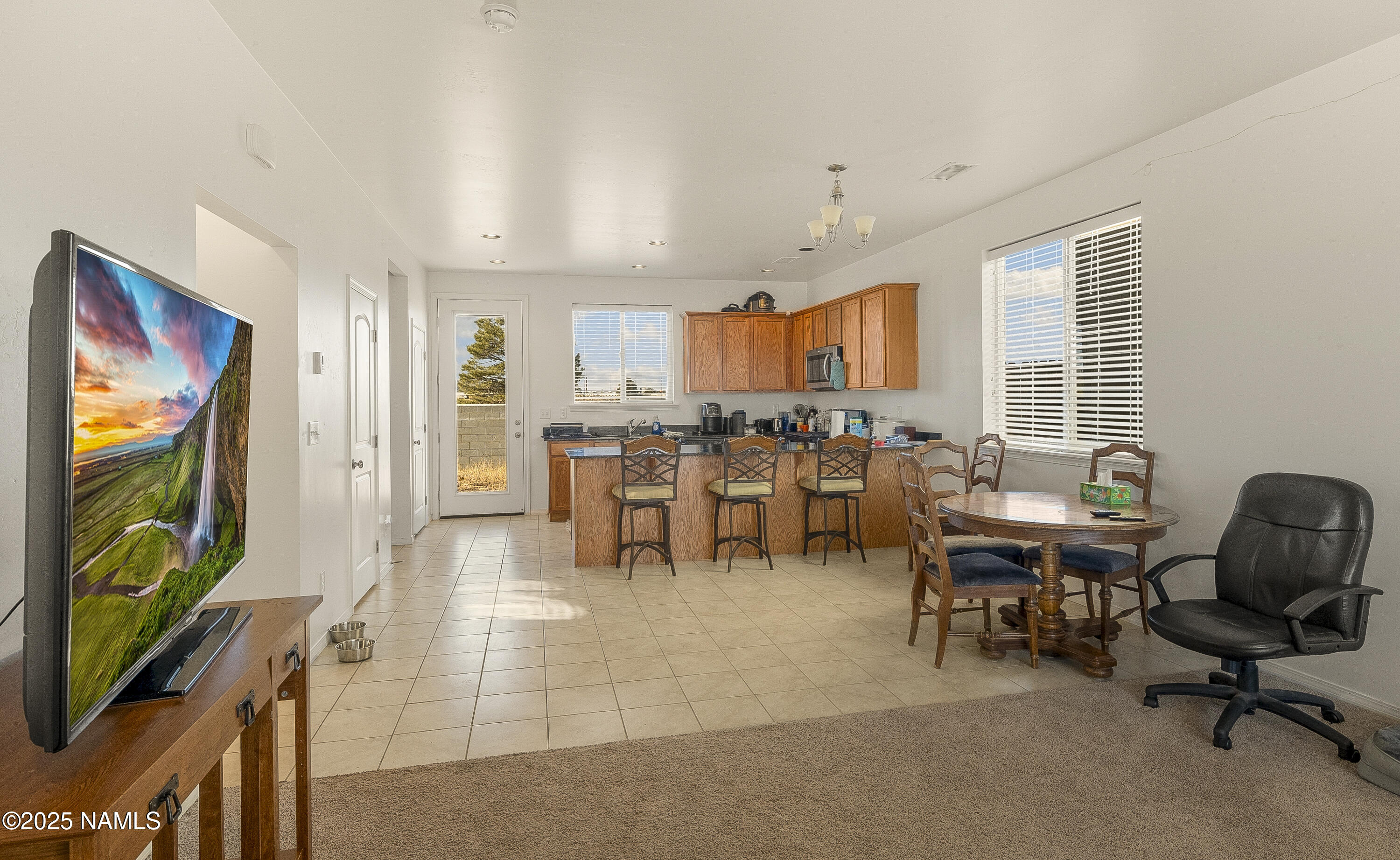 12361 Pegasus Road Bellemont, AZ 86015 - Photo 2 of 18 a view of a dining room with furniture window and outside view