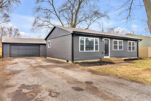 a house with trees in the background