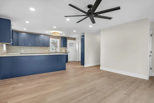 a kitchen with a refrigerator and a sink