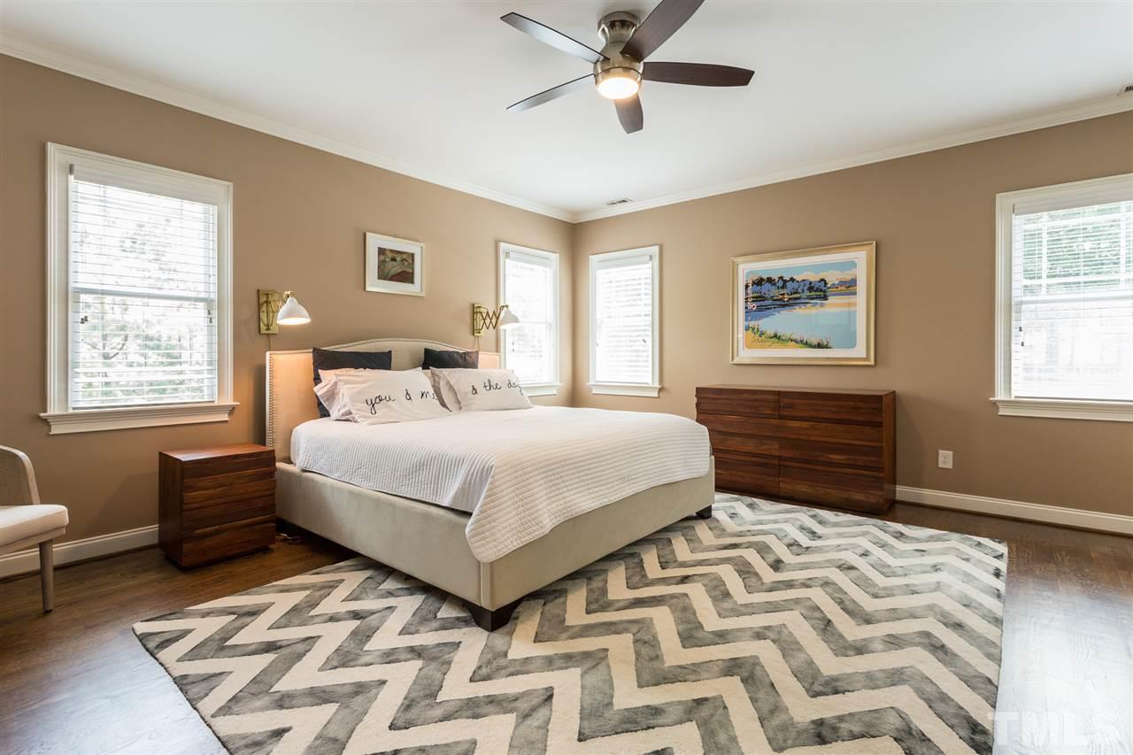 1716 Stannard Trail Raleigh, NC 27612 - Photo 14 of 30 Features of the master includes hardwood floors, crown molding, plantation blinds, ceiling fan, and a wonderful custom-designed walk-in closet.
