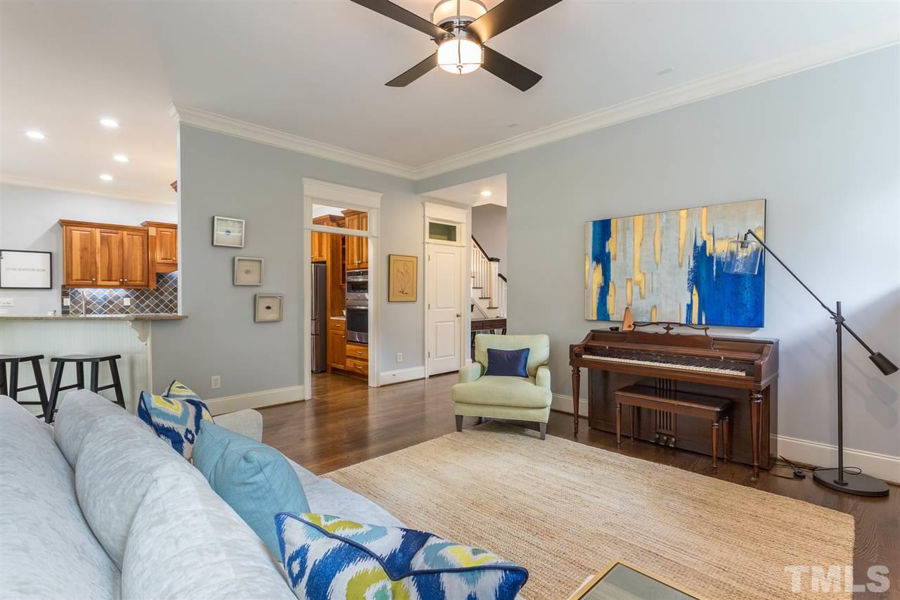 1716 Stannard Trail Raleigh, NC 27612 - Photo 8 of 30 Additional features of the family room include an updated ceiling fan and crown molding.