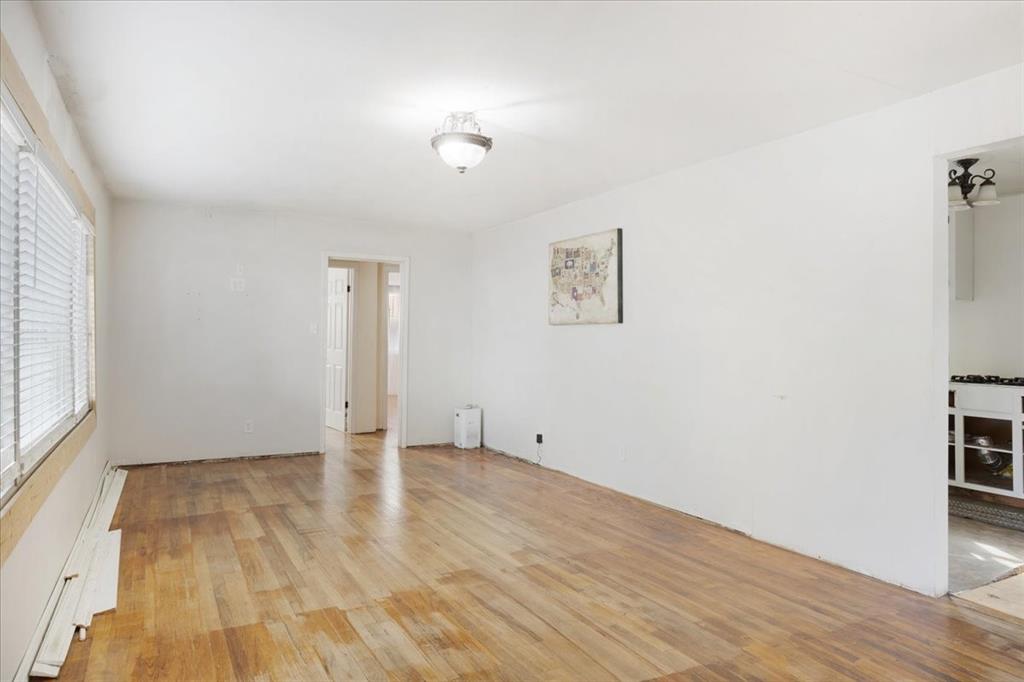 203 South Carter Street Whitewright, TX 75491 - Photo 3 of 18 Living room featuring light wood-style flooring