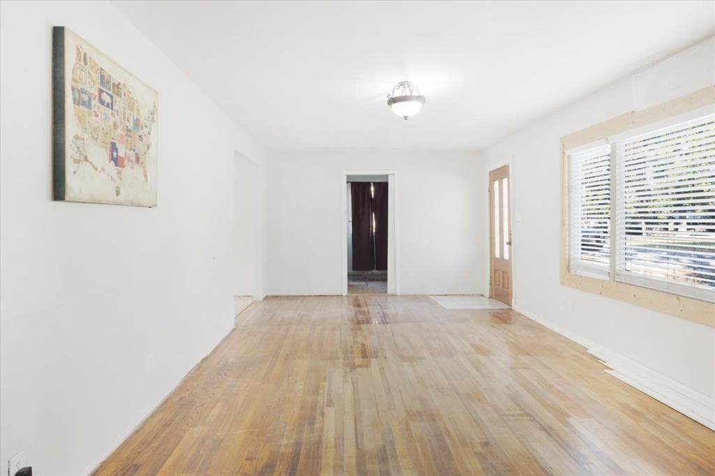 203 South Carter Street Whitewright, TX 75491 - Photo 4 of 18 Living room featuring wood finished floors