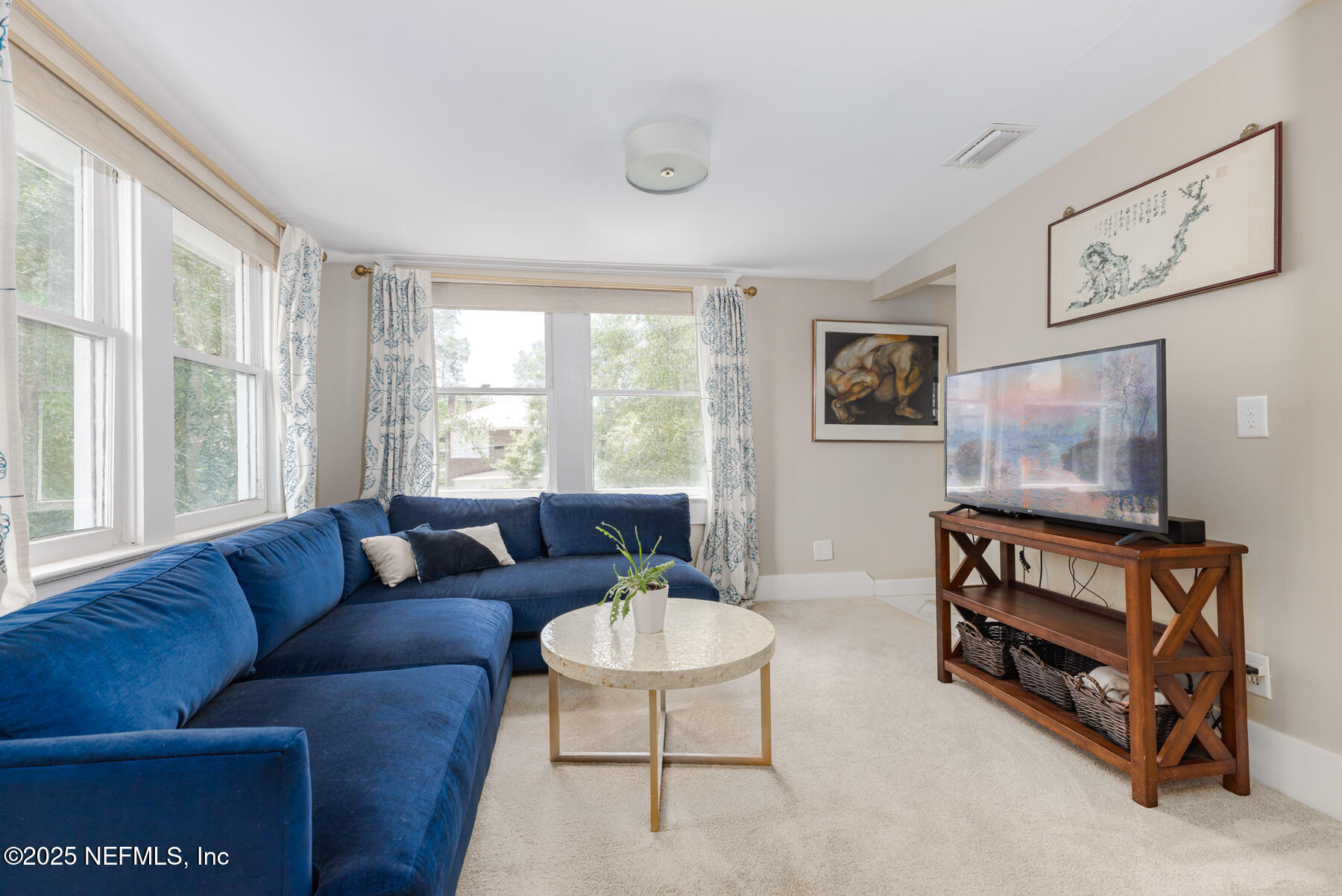 2122 Post Street Jacksonville, FL 32204 - Photo 43 of 69 a living room with furniture a flat screen tv and a window