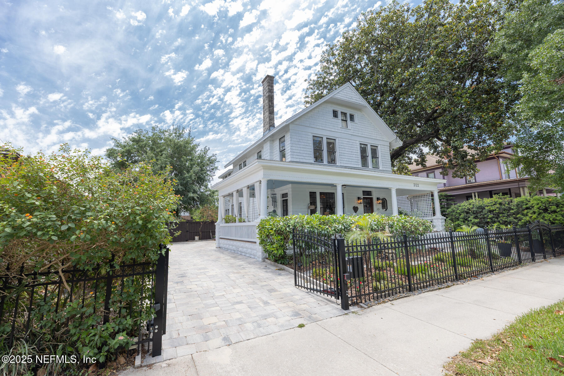 2122 Post Street Jacksonville, FL 32204 - Photo 68 of 69 a front view of a house with a yard and potted plants