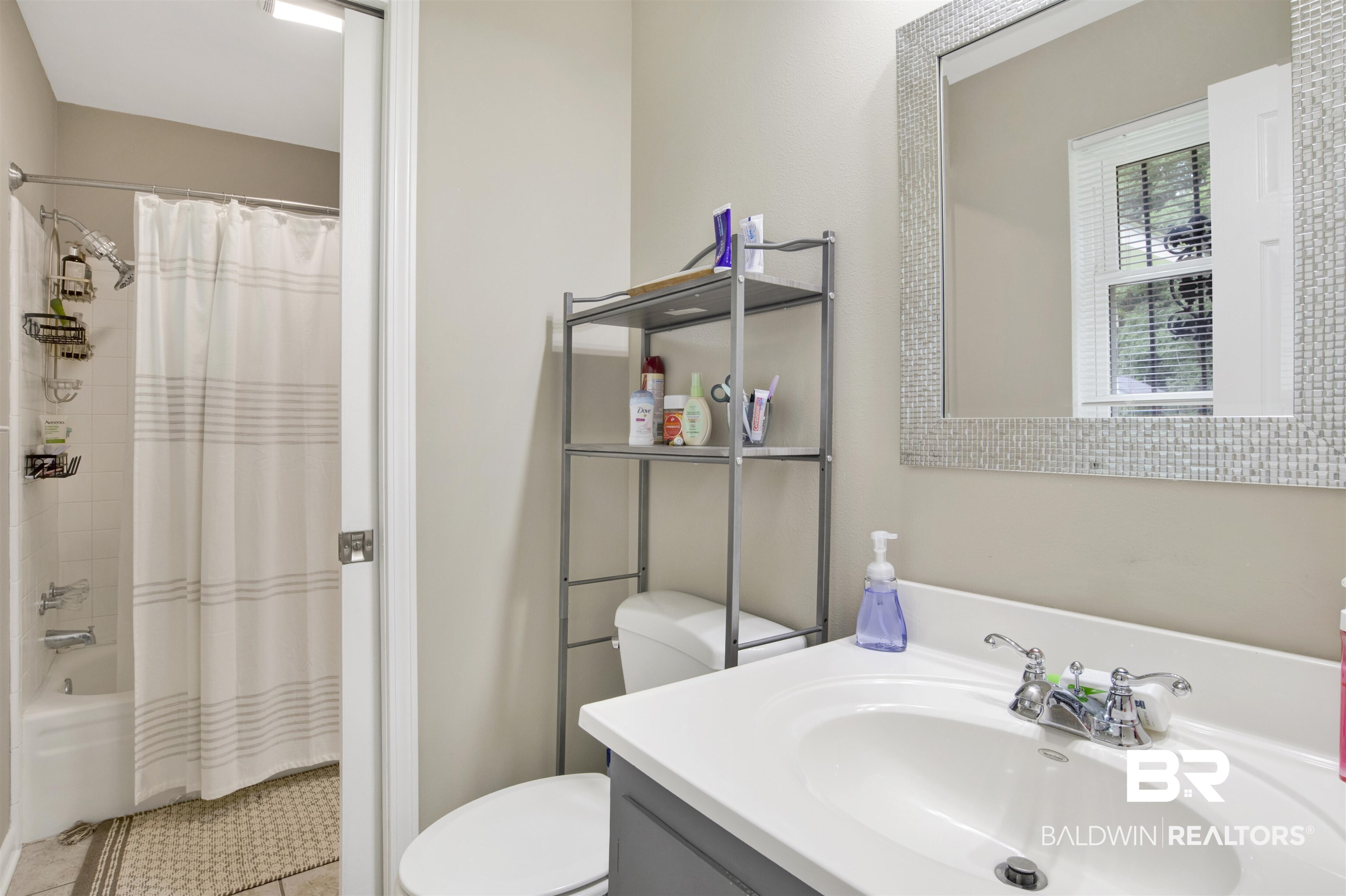 1476 Boudousquie Street Mobile, AL 36605 - Photo 18 of 34 Full bath featuring vanity, tile patterned floors, and shower / bath combo