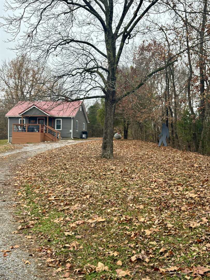 8350 Highway 147 Simpson, IL 62985 - Photo 2 of 23 a front view of a house with a yard